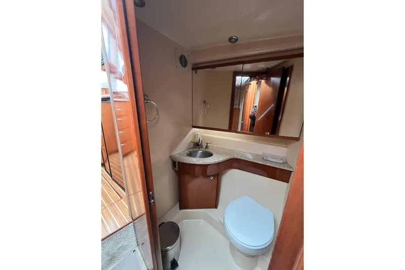 Slide: The Image of Luxurious bathroom in 2007 Meridian 391 Sedan yacht with modern fixtures and elegant design. - 14