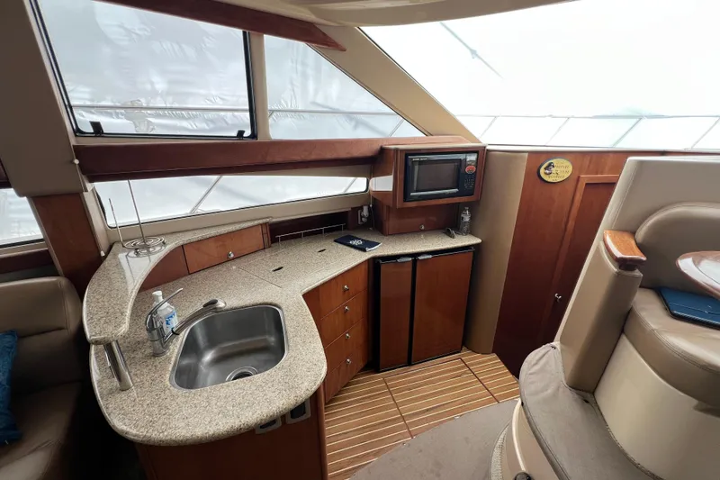 Slide: The Image of Luxurious 2007 Meridian 391 Sedan yacht interior with kitchenette and modern amenities. - 17