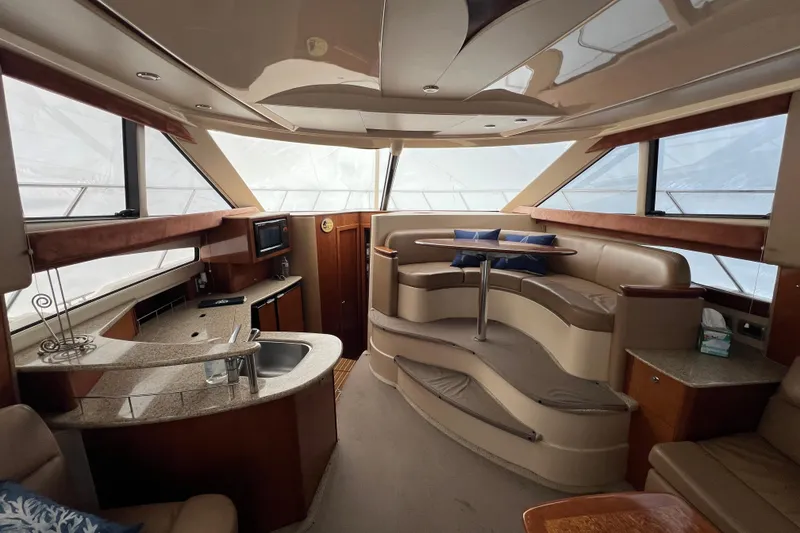 Slide: The Image of Luxurious interior of a 2007 Meridian 391 Sedan yacht with elegant seating and kitchenette. - 18