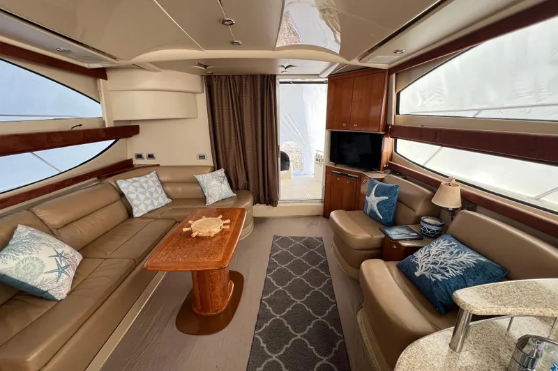 Slide: The Image of Luxurious interior of a 2007 Meridian 391 Sedan yacht with elegant seating and decor. - 19