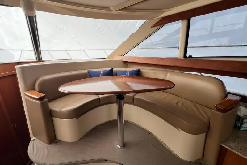 Slide: The Image of Luxurious interior of 2007 Meridian 391 Sedan with curved seating and wooden table. - 20