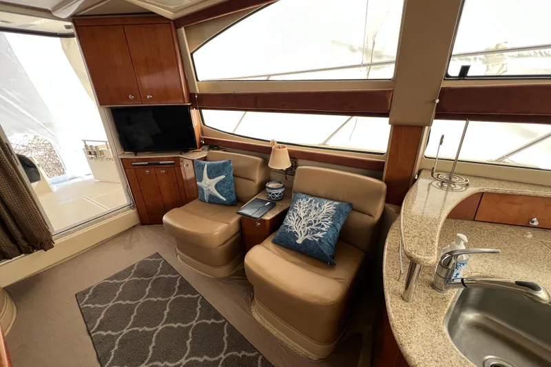 Slide: The Image of Luxurious interior of 2007 Meridian 391 Sedan yacht with cozy seating and elegant decor. - 21