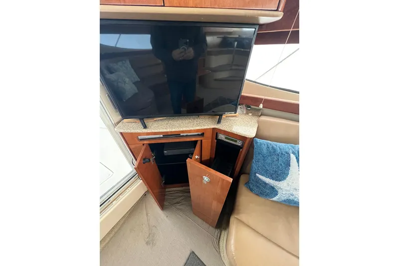 Slide: The Image of Interior of 2007 Meridian 391 Sedan with TV, cabinet, and starfish pillow. - 23