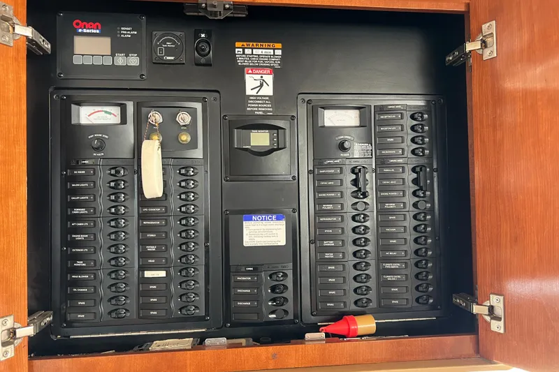 Slide: The Image of Electrical panel inside a 2007 Meridian 391 Sedan boat, featuring various switches and controls. - 25