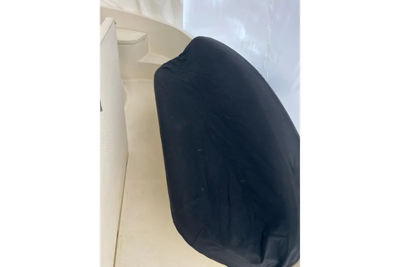 Slide: The Image of Black covered seat on 2007 Meridian 391 Sedan boat interior. - 28