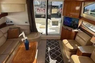 Slide: The Image of Luxurious interior of a 2007 Meridian 391 Sedan yacht with elegant seating and panoramic windows. - 3