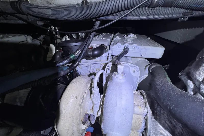 Slide: The Image of Engine compartment of a 2007 Meridian 391 Sedan, showcasing mechanical components and wiring. - 32