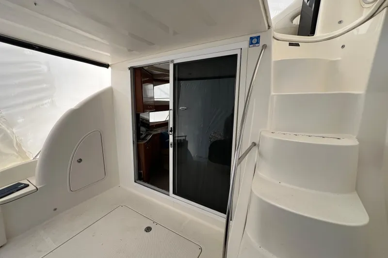 Slide: The Image of 2007 Meridian 391 Sedan yacht interior with sliding door and curved staircase. - 37