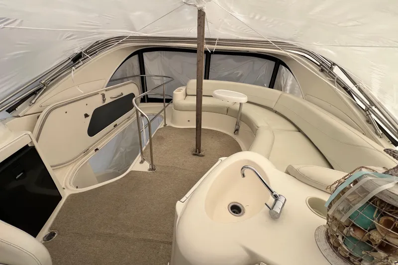 Slide: The Image of 2007 Meridian 391 Sedan interior with beige seating, small table, and sink. - 38