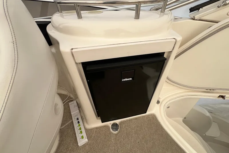 Slide: The Image of 2007 Meridian 391 Sedan interior with built-in black mini fridge. - 39