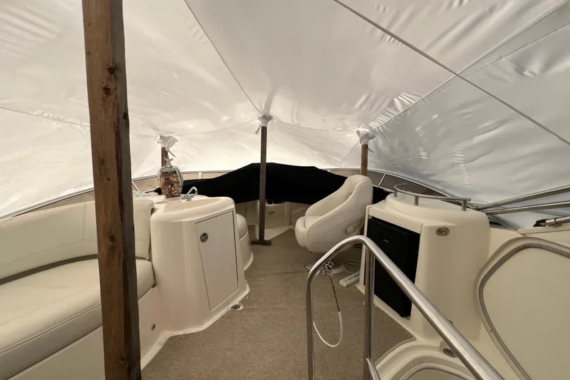 Slide: The Image of 2007 Meridian 391 Sedan interior under protective cover, featuring seating and helm area. - 40