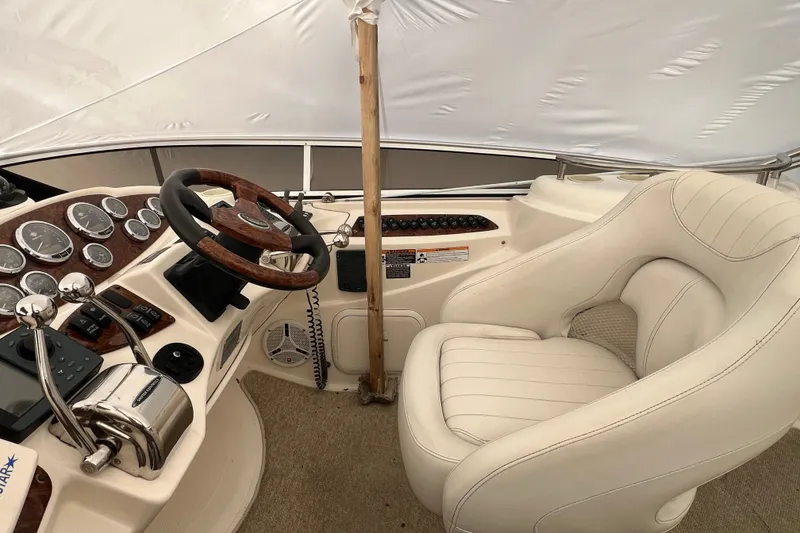 Slide: The Image of 2007 Meridian 391 Sedan helm with wood-accented steering wheel and plush captain's chair. - 46