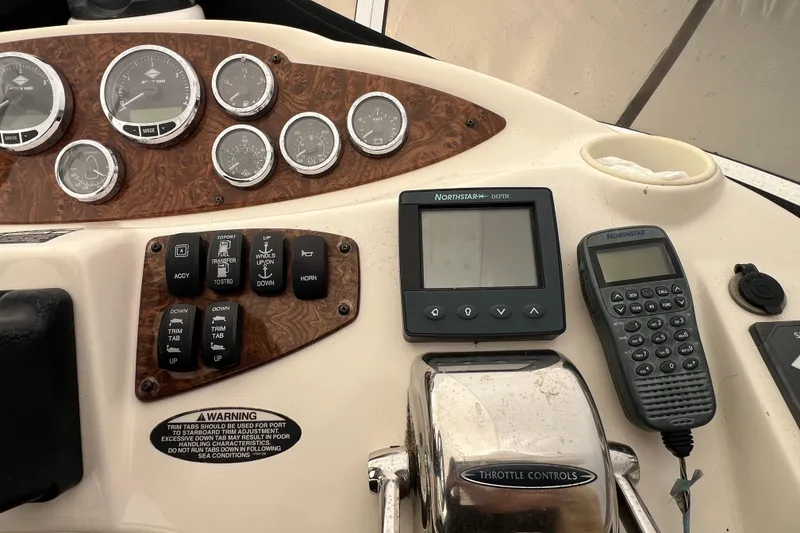 Slide: The Image of Control panel of a 2007 Meridian 391 Sedan boat with gauges and navigation equipment. - 48