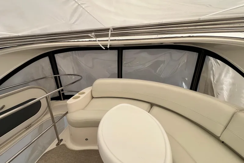 Slide: The Image of Interior of 2007 Meridian 391 Sedan yacht with white seating and table. - 50