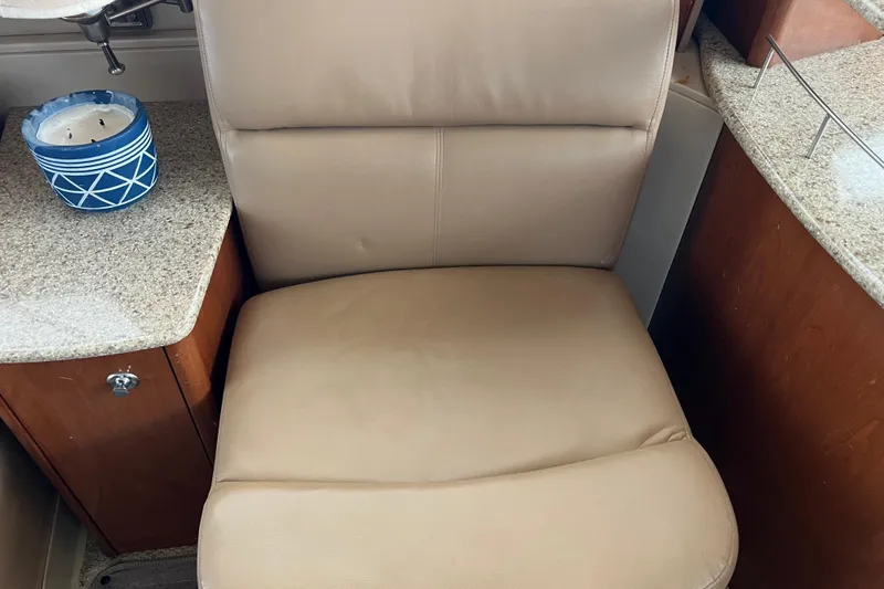 Slide: The Image of Beige leather seat in 2007 Meridian 391 Sedan yacht interior with candle on countertop. - 53