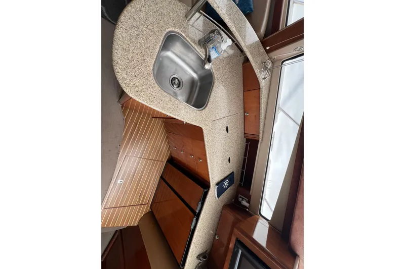 Slide: The Image of Interior of 2007 Meridian 391 Sedan yacht featuring a modern kitchen area. - 57