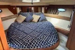 Slide: The Image of 2007 Meridian 391 Sedan yacht interior with helm, seating, and mounted TV. - 7