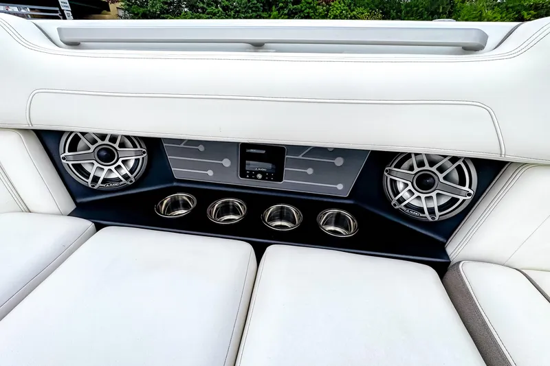 Slide: The Image of 2026 Ingenity EL boat interior with speakers and cup holders, featuring sleek white seating. - 15