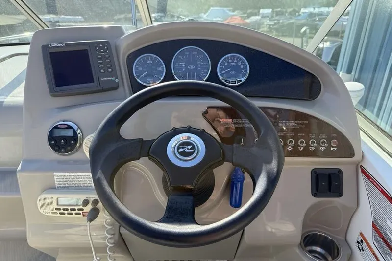 Slide: The Image of Steering console of 2007 Sea Ray Sundancer 540 with navigation equipment and controls. - 10