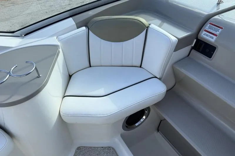 Slide: The Image of Luxurious seating on 2007 Sea Ray Sundancer 540 yacht, featuring white upholstery and cup holders. - 14