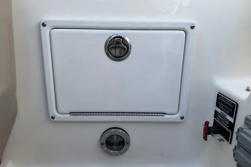 Slide: The Image of 2007 Sea Ray Sundancer 540 boat compartment with latch and safety instructions. - 15