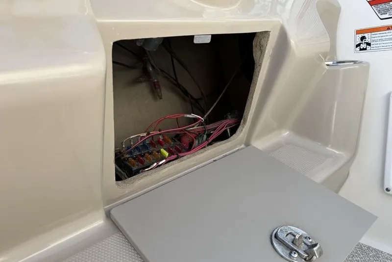 Slide: The Image of Open electrical panel on 2007 Sea Ray Sundancer 540 boat, showing wiring and fuses. - 16