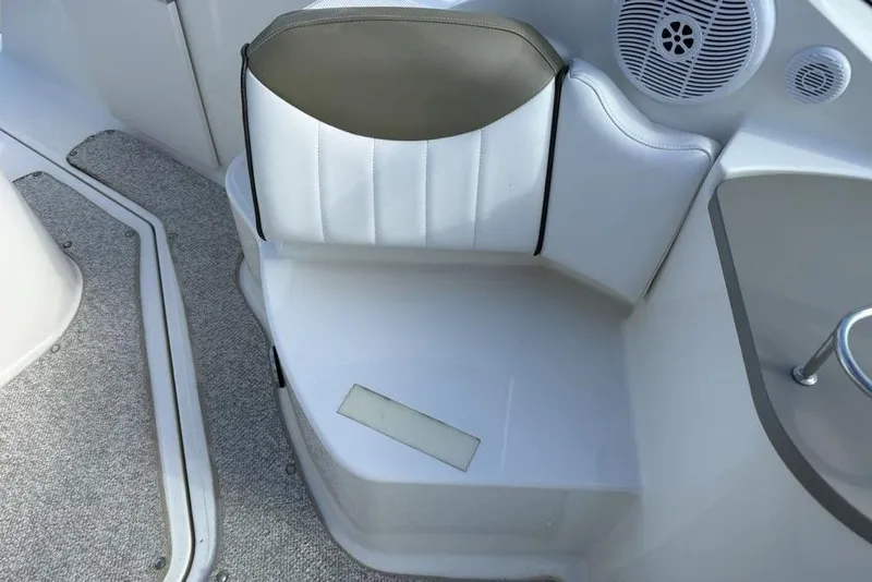 Slide: The Image of 2007 Sea Ray Sundancer 540 interior seating with speaker and carpeted flooring. - 17