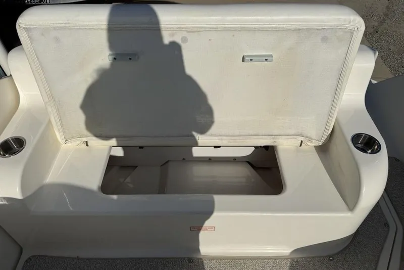 Slide: The Image of Open storage compartment on 2007 Sea Ray Sundancer 540 boat with cup holders. - 25