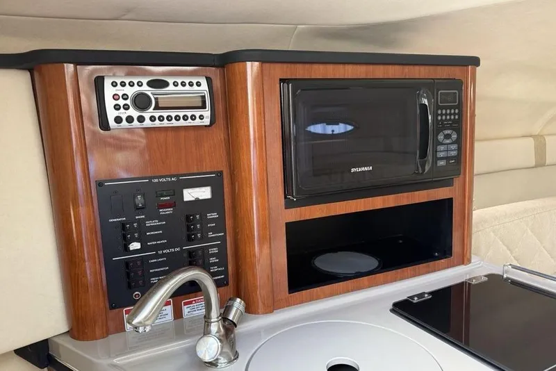 Slide: The Image of 2007 Sea Ray Sundancer 540 interior with microwave, control panel, and sink. - 28