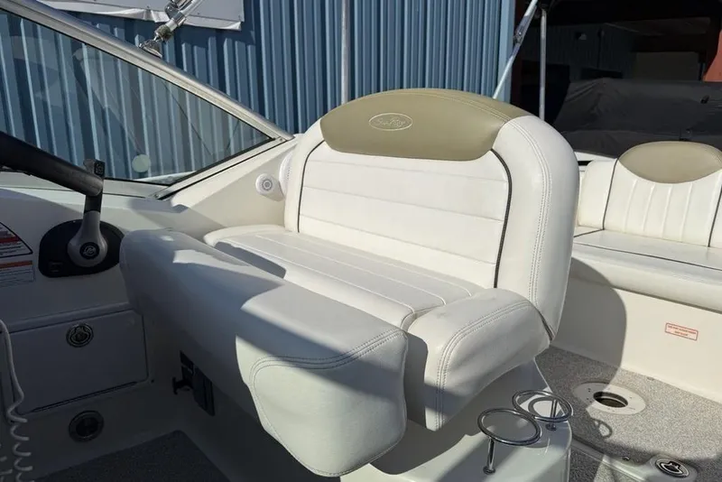 Slide: The Image of 2007 Sea Ray Sundancer 540 cockpit with white leather seating and steering wheel. - 3