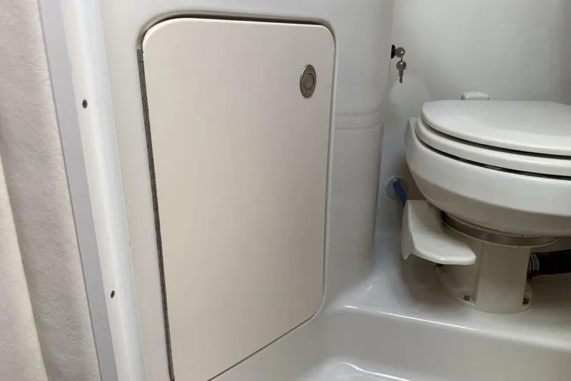 Slide: The Image of Bathroom interior of 2007 Sea Ray Sundancer 540 yacht, featuring a compact toilet. - 40