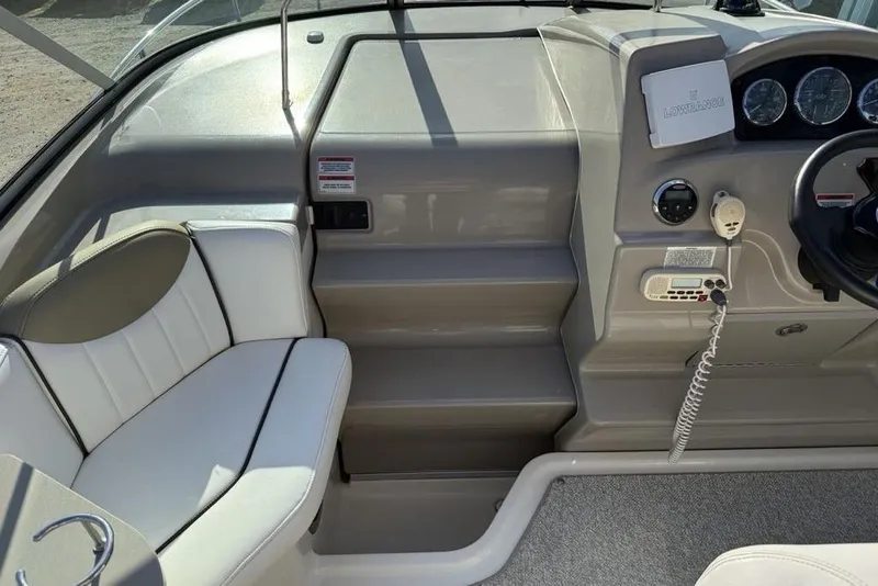 Slide: The Image of 2007 Sea Ray Sundancer 540 helm with seating, steering wheel, and navigation equipment. - 22