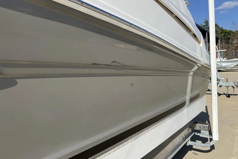 Slide: The Image of 2007 Sea Ray Sundancer 540 yacht side view with visible hull details. - 5