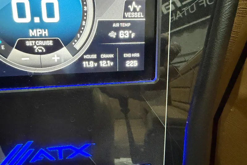 Slide: The Image of ATX Surf Boats 24 Type-S 2022 dashboard displaying speed, air temperature, and engine hours. - 11