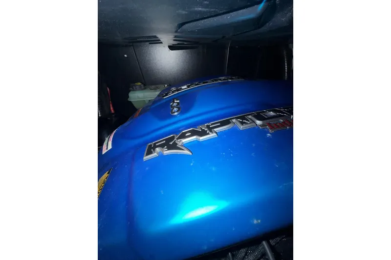 Slide: The Image of Close-up of 2022 ATX Surf Boats 24 Type-S engine with Raptor branding. - 12