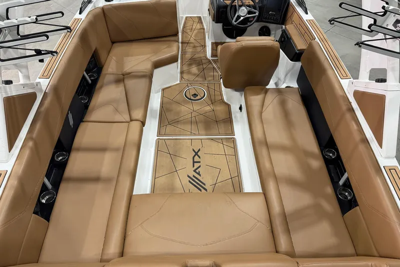 Slide: The Image of 2022 ATX Surf Boats 24 Type-S interior with tan seating and sleek design. - 4