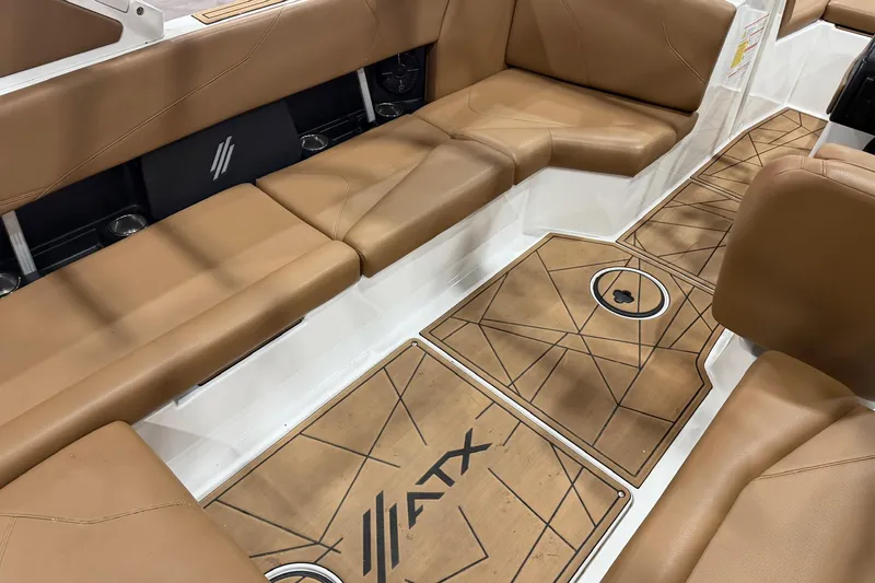 Slide: The Image of 2022 ATX Surf Boats 24 Type-S interior with tan seating and custom flooring. - 5