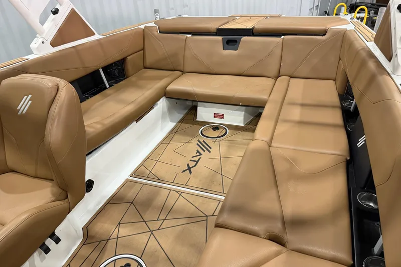 Slide: The Image of 2022 ATX Surf Boats 24 Type-S interior with tan leather seating and modern design. - 7