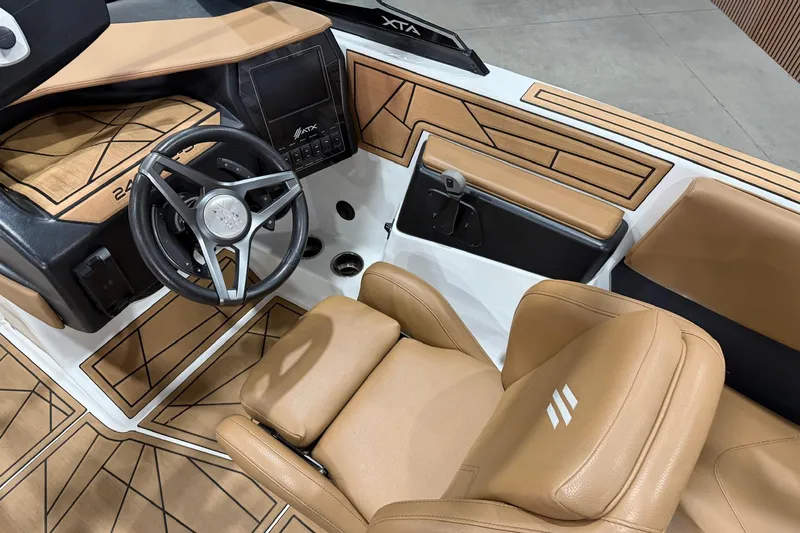 Slide: The Image of 2022 ATX Surf Boats 24 Type-S interior with tan leather seats and modern dashboard. - 8