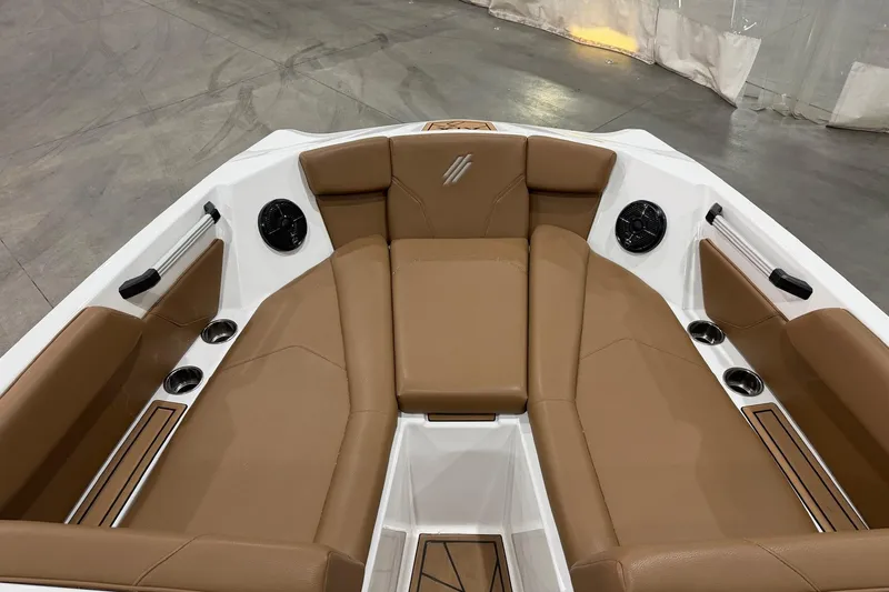 Slide: The Image of 2022 ATX Surf Boats 24 Type-S interior with tan seating and cup holders. - 9