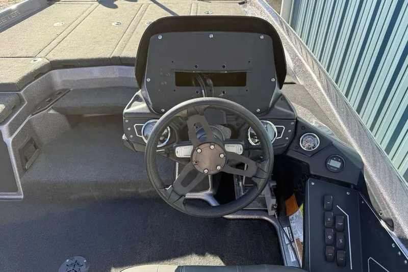 Slide: The Image of 2021 Skeeter ZXR21 boat cockpit with steering wheel and control panel. - 17