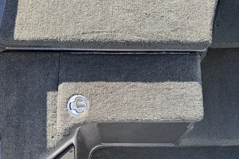 Slide: The Image of Carpeted deck of 2021 Skeeter ZXR21 boat with metal latch. - 21