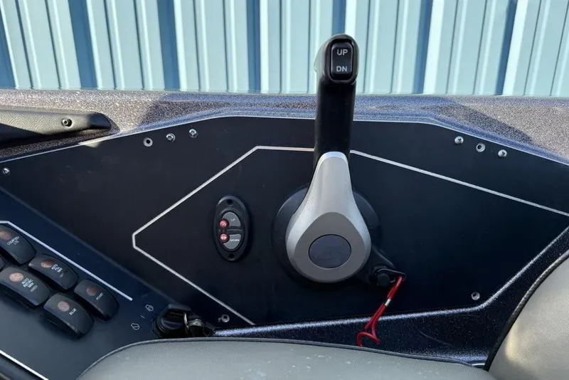 Slide: The Image of Control panel of 2021 Skeeter ZXR21 boat with throttle and switches. - 23