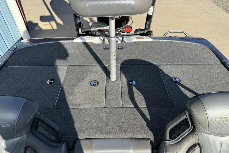 Slide: The Image of 2021 Skeeter ZXR21 boat interior with gray seating and carpeted deck. - 24