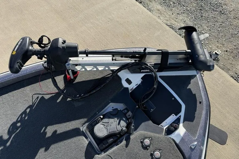 Slide: The Image of 2021 Skeeter ZXR21 boat with Minn Kota trolling motor on deck. - 9