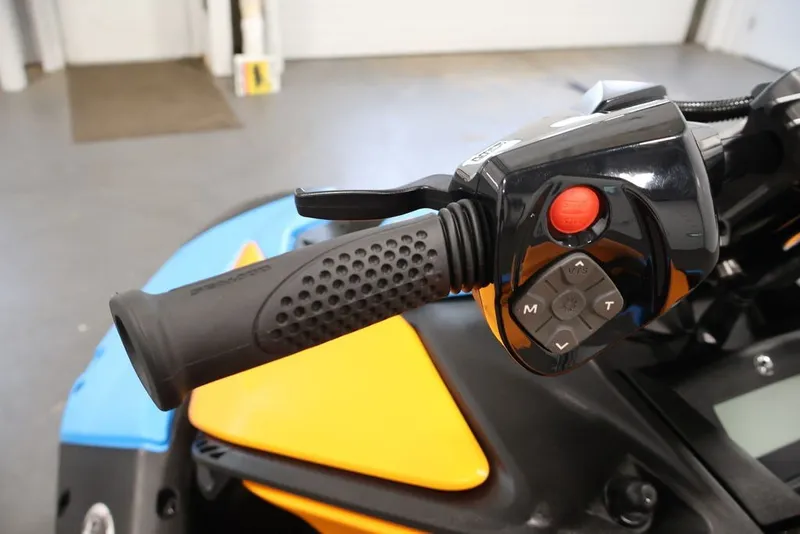 Slide: The Image of Handlebar controls of 2026 Sea-Doo Spark Trixx, featuring ergonomic grip and control buttons. - 11
