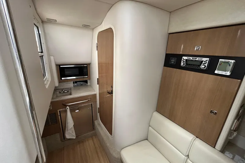 Slide: The Image of 2017 Formula 350 Crossover Bowrider interior with kitchenette and seating area. - 14