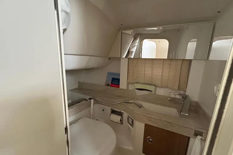 Slide: The Image of 2017 Formula 350 Crossover Bowrider bathroom with sink, mirror, and toilet. - 16
