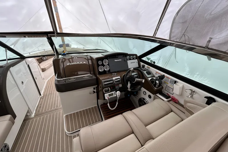 Slide: The Image of 2017 Formula 350 Crossover Bowrider cockpit with modern controls and luxurious seating. - 9