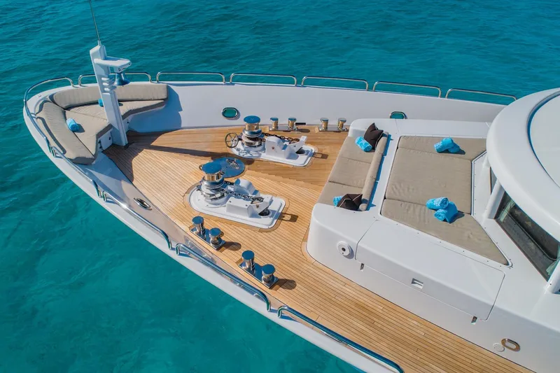 Slide: The Image of Luxurious 1988 Van Mill Custom yacht deck with seating, overlooking clear blue water. - 15